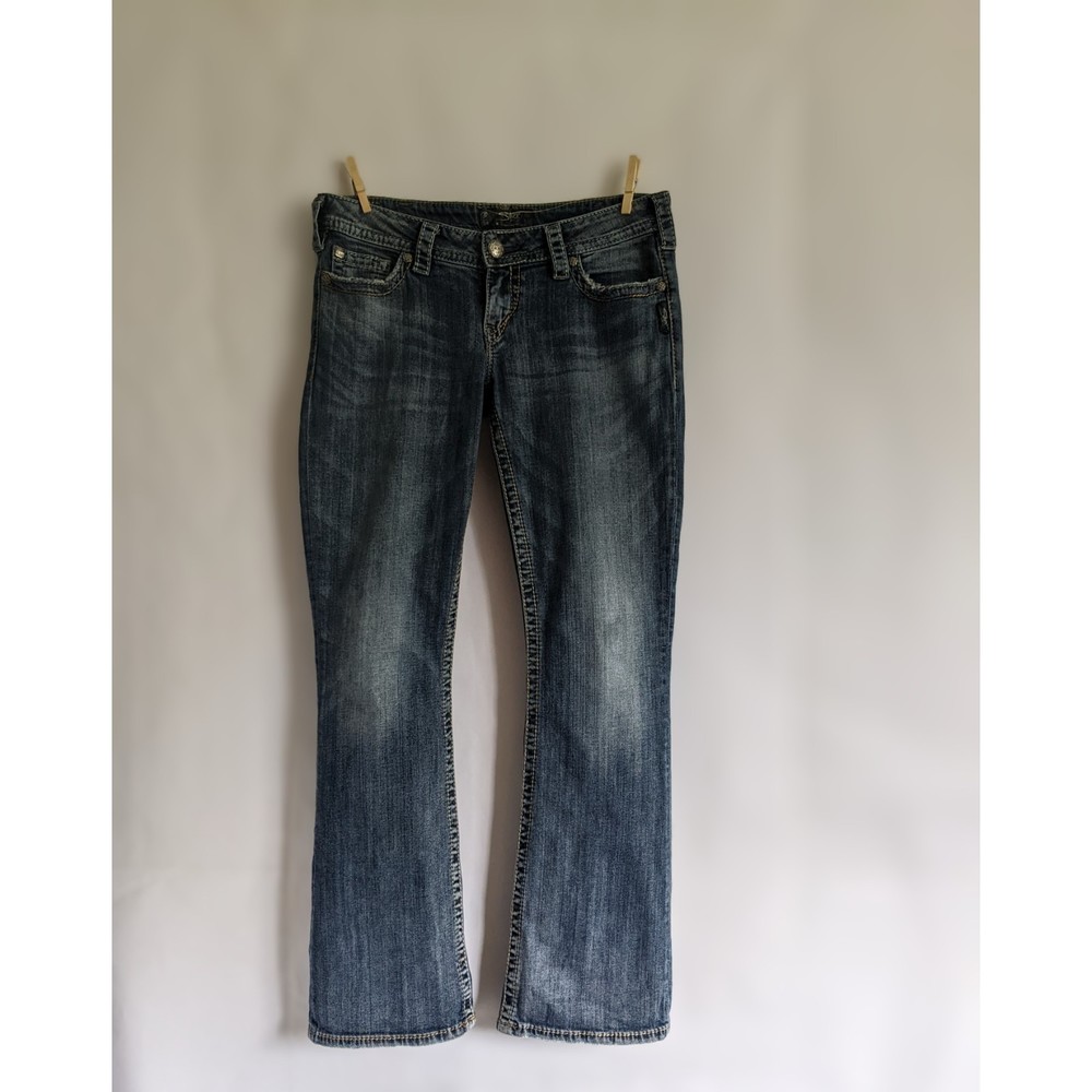 Silver Jeans Co. Pioneer, 30W/31L. Low rise, boot cut, buttoned butt